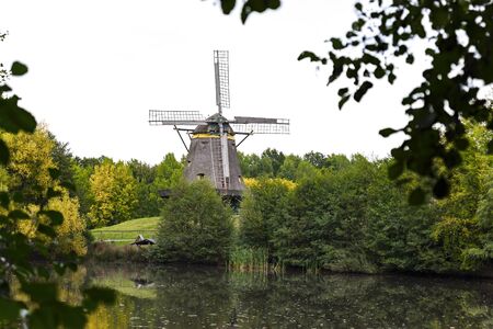 Ancient wooden windmill in Germanyの写真素材