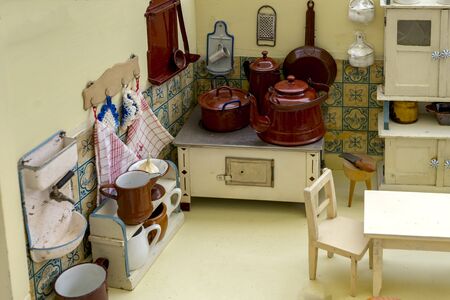 Grandmother's Old Dolls Kitchen with accessories. Toys for girls from the 40s or 50s.の写真素材