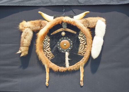 Indian dreamcatcher symbol is hung up in front of a black tentの写真素材
