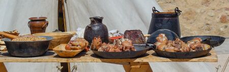 Fried pork knuckles on metal plates. Traditional German food.の写真素材