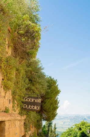 Sign of public toilets in Pienza in Tuscany Italy