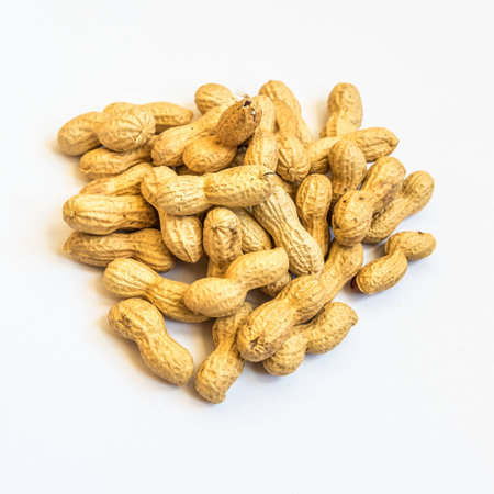 Pile of peanuts to peel on white background