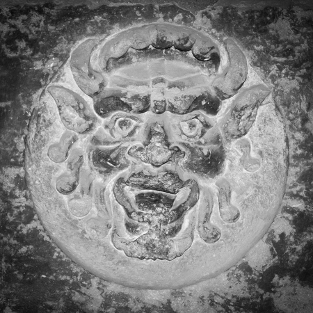 Sculpture on a wall in the town of Cortona in Tuscany - Italyの写真素材