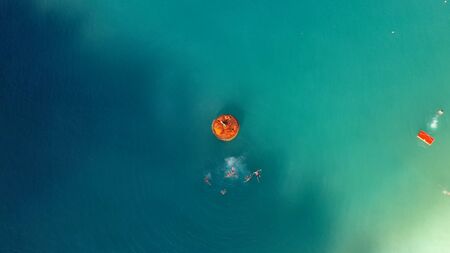 Aerial View of People swimming in the Ionian Sea.の写真素材