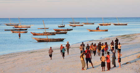 Playing football on the beachのeditorial素材