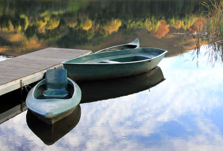 Boats reflected in the waterの写真素材