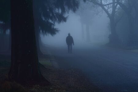 Figure walking on a mosty streetの写真素材