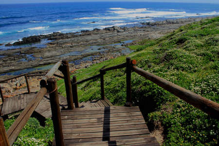 Wooden walkway down to the seasideの写真素材