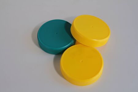 Yellow and blue plastic lids