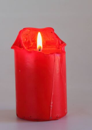 A red candle - portrait formatの写真素材