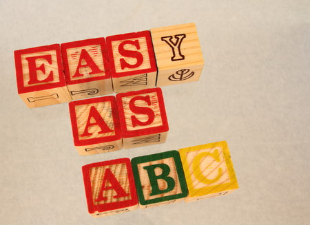 Easy as ABC - phrase represented by kids' wooden toy blocksの写真素材