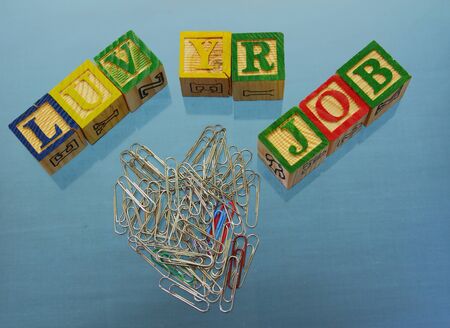 Love your job - phrase on a clear blue background using toy bloocks