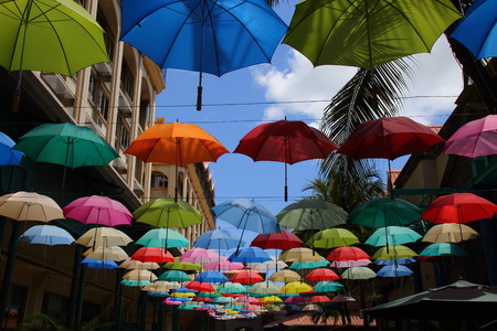 Port Louis, Mauritius - colorful umbrellas above a shopping lane in the Le Caudan Waterfront in the capital of the Indian Ocean island in landscape formatのeditorial素材
