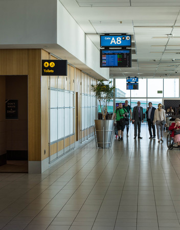 Cape Town, South Africa - unidentified passengers await their flights at the local departures terminal at Cape Town International Airport in the cityのeditorial素材