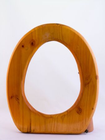 Wooden toilet seat isolated against a white background for own design use image with copy spaceの写真素材