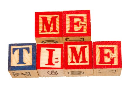 The term me time displayed visually on a white background using colorful wooden toy blocks image with copy space in landscape formatの写真素材