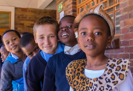 Johannesburg, South Africa - unidentified school children, some in traditional dress, celebrate...