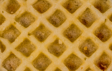 Geometric patterns - symmetry in everyday life objects - a close up image of a waffle with copy spaceの写真素材