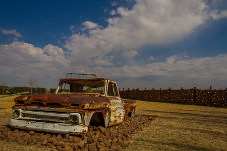 Old truck in an empty playground image with copy space in landscape formatの写真素材