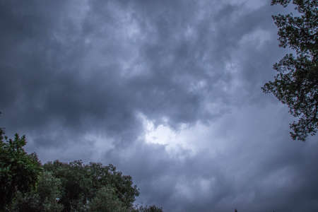 Thunder clouds build up over Johannesburg in Gauteng province in South Africa for a seasonal summer stormの写真素材