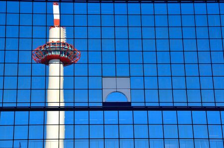 Train station Kyoto Tower reflected in the buildingのeditorial素材
