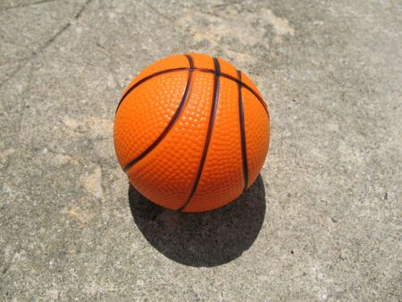 A simple basketball lying on the basketball courtの写真素材