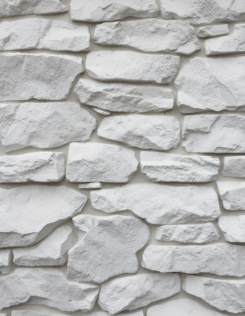 White stone wall texture background. Close up of decorative stone wall.の素材