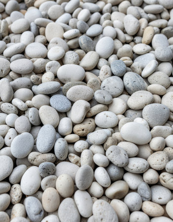 White pebbles on the beach, close-up. Backgroundの素材