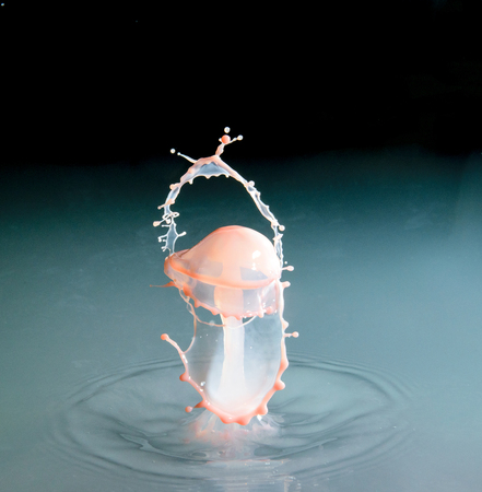 Falling drops of water. Splash effect after collision a falling drops with water Surfaceの写真素材