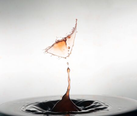 Falling drops of water. Splash effect after collision a falling drops with water Surfaceの写真素材