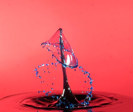 Falling drops of water. Splash effect after collision a falling drops with water Surfaceの写真素材