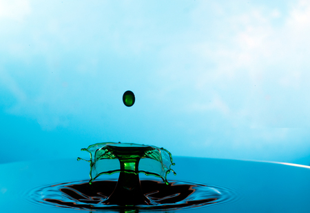 Falling drops of water. Splash effect after collision a falling drops with water Surfaceの写真素材