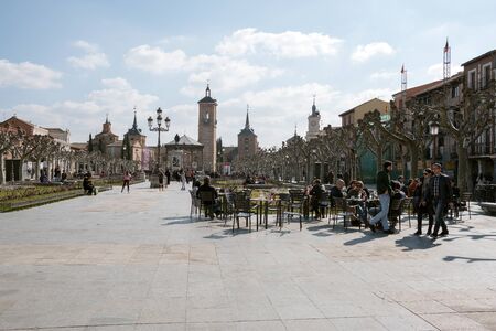 Alcala de Henares, Madrid, Spain- February 19, 2017. People having an aperitif on the terrace of a...