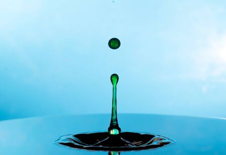 Falling drops of water. Splash effect after collision a falling drops with water Surface