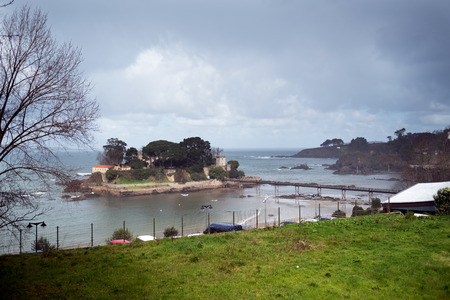 Different views of a medieval castle, near the beach and connected by a bridge in La coruna, Galicia, Spainのeditorial素材