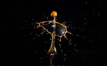 Images forming two drops of water when colliding after falling in waterの写真素材