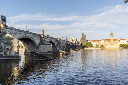 View of the Charles bridge and the Liechtenstein Palace on the Vltava river from the shore of Stare Mesto in Prague. Czech Republicのeditorial素材