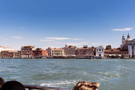 Venice, Veneto / Italy- May 20, 2017: View of the shores of the island called "Giudecca" sailing in a vaporettoのeditorial素材
