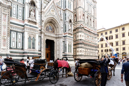 Typical horse-drawn carriages on the main facade of the cathedral of Florence "Duomo" called "Santa Maria del Fiore"のeditorial素材