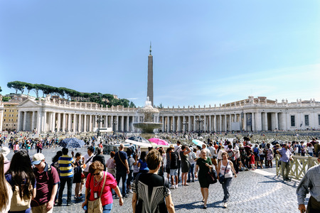 Rome, Lazio, Italy. May 25, 2017: Panoramic view of St. Peter's Square in the Vatican state and its arcades with people walking under a magnificent blue skyのeditorial素材