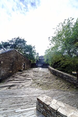 Stone access road to the monastery of Caaveiro dating from the tenth century and which hosted hermits of the area, in Galicia, Spain. A very green landscape without peopleの写真素材