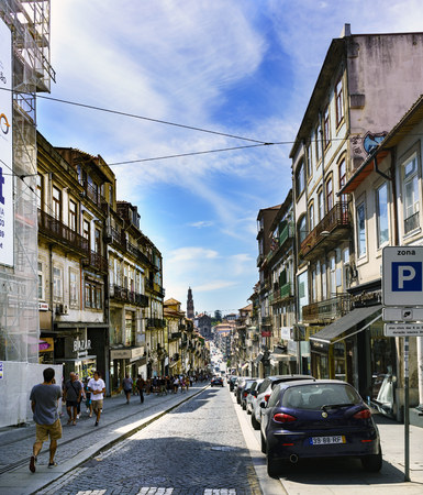 Porto, Portugal. August 12, 2017: Commercial street called January 31 paved with cobblestones with a very strong slopeのeditorial素材