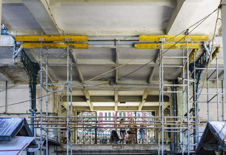 Porto, Portugal. August 12, 2017: Scaffolding for the neoclassical market reform called Do Bolhao in downtown Oporto. With young people looking insideのeditorial素材