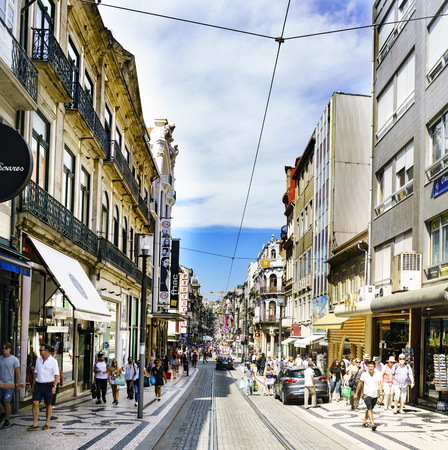 Porto, Portugal. August 12, 2017: View of the commercial street called Santa Catarina (Saint Catherine) with tram tracks, many small shops and lots of people strollingのeditorial素材