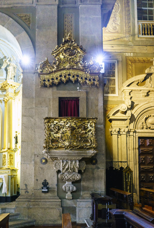 Porto, Portugal. August 12, 2017: Interior of the Saint Anthony's Church Congregates built in the eighteenth century and very polychrome detail of the golden pulpit on one sideのeditorial素材