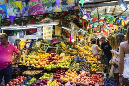 Porto, Portugal. August 12, 2017: fruit and vegetable stand of the market called "Mercado do Bolhao" in the center of the city with many turtles looking at the productsのeditorial素材