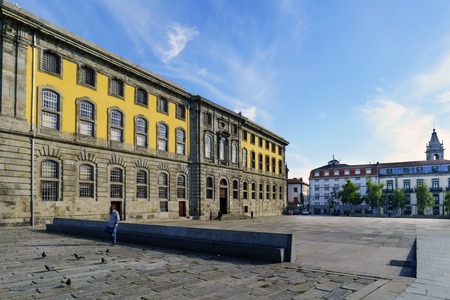 Porto, Portugal. August 12, 2017, Stone facade of the Portuguese Center in the square called Martyrs of the Fatherland with tourists strolling. It used to be the city jail.のeditorial素材