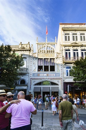 Porto, Portugal. August 12, 2017: The library called Lello facade where J. K. Rowling was inspired for the diagon alley bookstore, with many tourists visiting it and houses aroundのeditorial素材