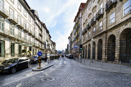 Porto, Portugal. August 12, 2017: Central street of the city wide and cobbled with cobblestones with facades of old stone houses and little trafficのeditorial素材