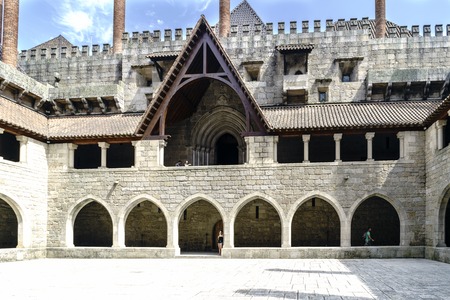 Guimaraes, Portugal. August 14, 2017: Main courtyard of the Palace of the Dukes of Braganza, in Norman style built in granite and magnificently preserved stone, is the only one of this style in Portigalのeditorial素材